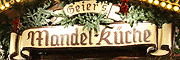 Geiers Mandelküche auf dem Münchner Christkindlmarkt vor dem C&A in der Fußgängerzone: Biomandeln, Schokomandeln, Vanillemandeln, exotische Nüsse